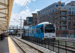 A light rail vehicle is stabled next to Union Station 